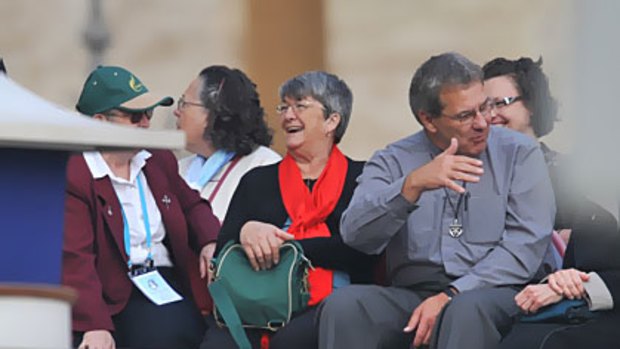 Blessings ... Hunter Valley grandmother Kathleen Evans in red scarf, the recipient of a miracle, in St Peter's Square yesterday.