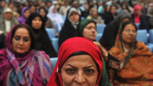 Determined ... women delegates listen to President Hamid Karzai speaking at a four-day traditional gathering known as a loya jirga, held near Kabul under tight security.
