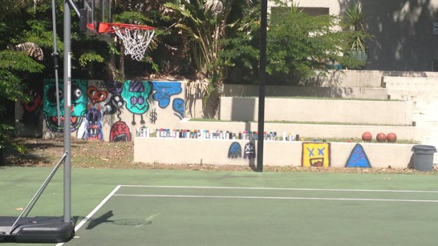 Spray paint cans can be clearly seen at the tennis courts of the QT Hotel, after Justin Bieber wound down after his first Australian concert by unleashing his artistic side.