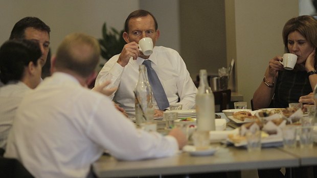 The calorie-conscious Tony Abbott enjoys a skim mocha with local business owners in Queanbeyan on Thursday ... but leaves the pastries.