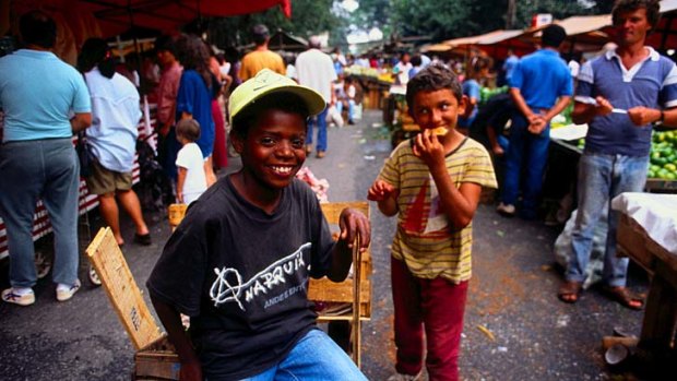 Children in a street market ... Sao Paulo both bucks and confirms Brazilian stereotypes.
