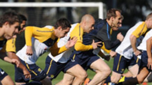 Left: It's all feet on deck as the Socceroos do sprint work at Monash University yesterday.  Right: Young guns, including James Holland and Luke Wilkshire and Tommy Oar, have not been overawed by their surroundings.