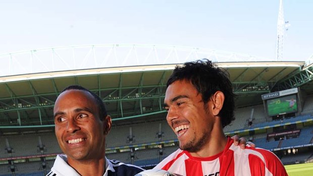 Facing off: Melbourne Victory's Archie Thompson and Heart's David Williams.