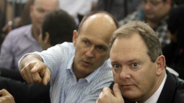 The Australian ambassador to Egypt, Dr Ralph King, right, sits next to Andrew Greste, brother of defendant Peter Greste during the sentencing hearing.
