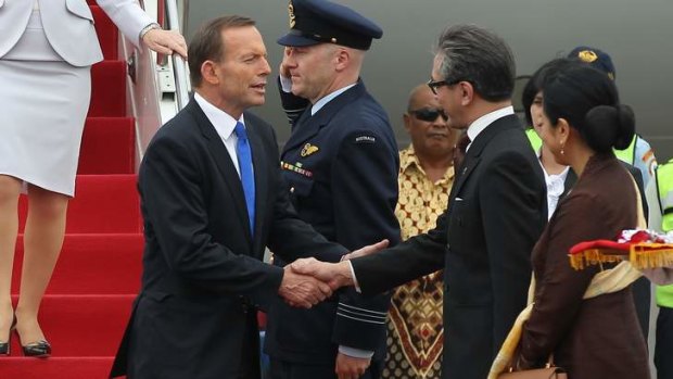 Friendly face: Tony Abbott is greeted by Foreign Affairs Minister Marty Natalegawa on his arrival in Jakarta.