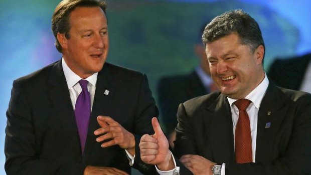 Thumbs up: British Prime Minister David Cameron laughs with Ukrainian President Petro Poroshenko during the NATO summit.