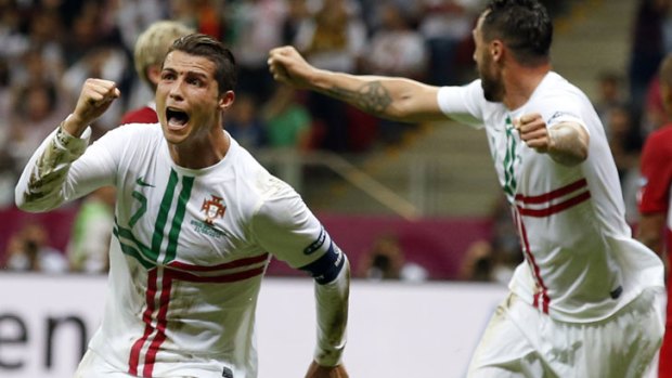 Portugal's Cristiano Ronaldo (left) celebrates scoring.