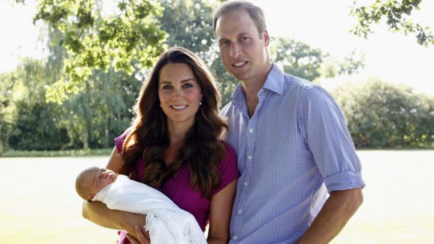 Catherine, Duchess of Cambridge and Prince William, Duke of Cambridge, with their son Prince George. Australia has been blamed for delaying changes to the royal succession laws.