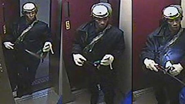 Surveillance photo provided by the New York Police Department shows a suspect wanted in connection with a woman burned to death in the elevator of her Brooklyn flat.