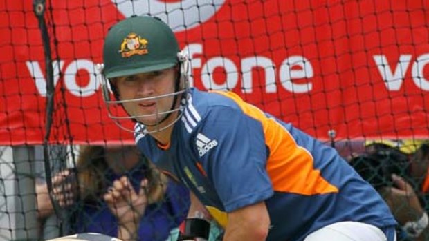 Michael Clarke is watchful in the nets yesterday.