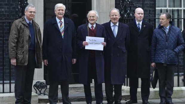 Against the move ... Senior Conservatives with a letter addressed to David Cameron.