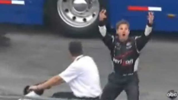 Will Power gives IndyCar officials a two-fingered salute.