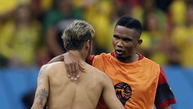 Brazil's Neymar, left, talks to Cameroon's Samuel Eto'o after a 4-1 win over Cameroon in Group A.