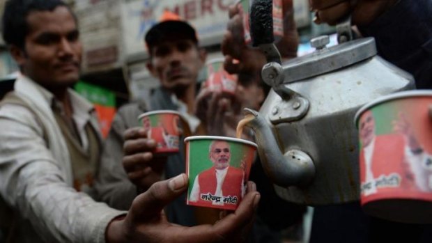 Paper cups bearing the portrait of prime ministerial candidate Narendra Modi are pictured as party workers distribute free tea at a promotional event.