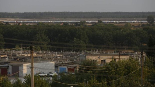 Trucks of a Russian convoy carrying humanitarian aid for Ukraine are parked at the military air base outside Voronezh.