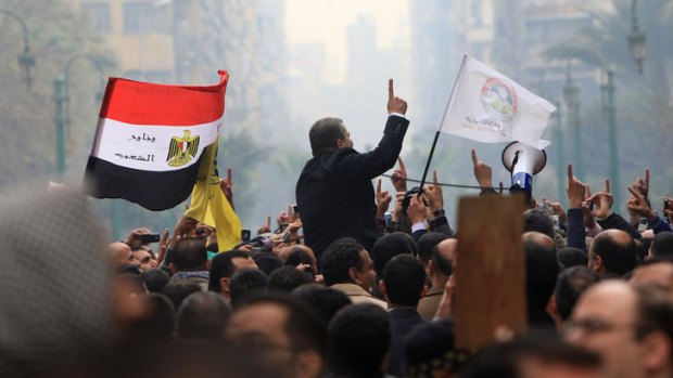 Supporters of Egypt's Muslim Brotherhood shout slogans outside the parliament in Cairo on January 23, 2012.