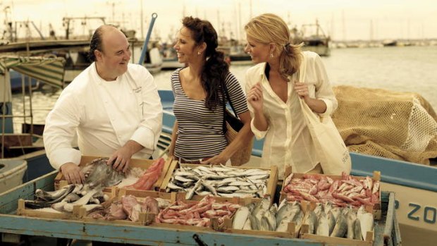 Healthy and light: shopping at a fish market with the chef on a Seabourn excursion.