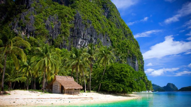 True colours ... a lone outpost on the sands of a Palawan beach.