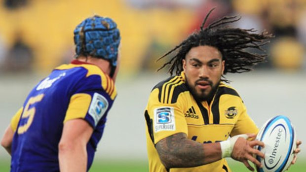 Ma'a Nonu of the Hurricanes attempts to step around Josh Bekhuis of the Highlanders.