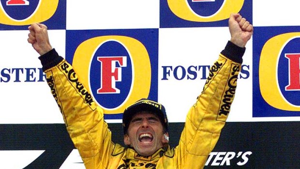 Winning feeling: Damon Hill on the podium in Belgium in 1998.