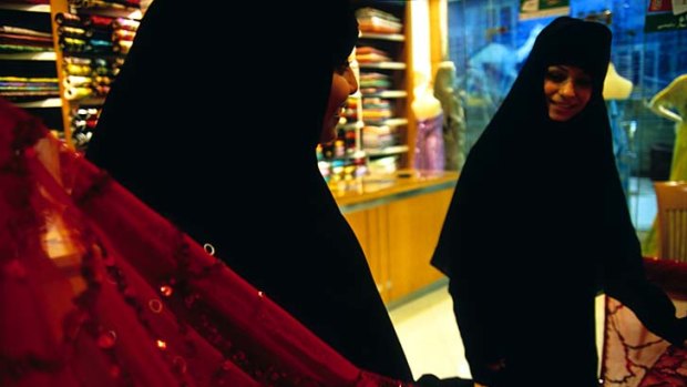Bargain hunters ... women shop for fabrics in Dubai.