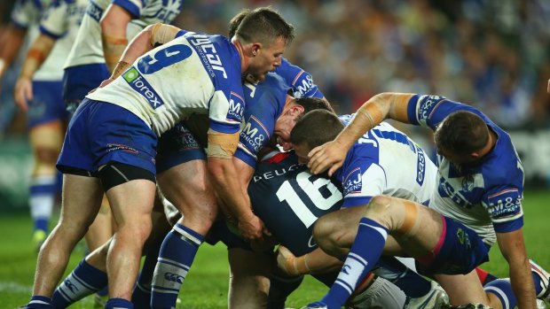 Key moment: Kane Evans scores a controversial try against the Bulldogs on Friday night.