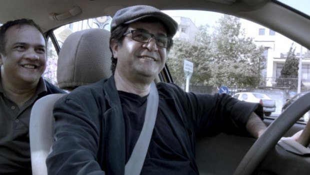 Banned: Director-star Jafar Panahi in <i>Tehran Taxi</i>.