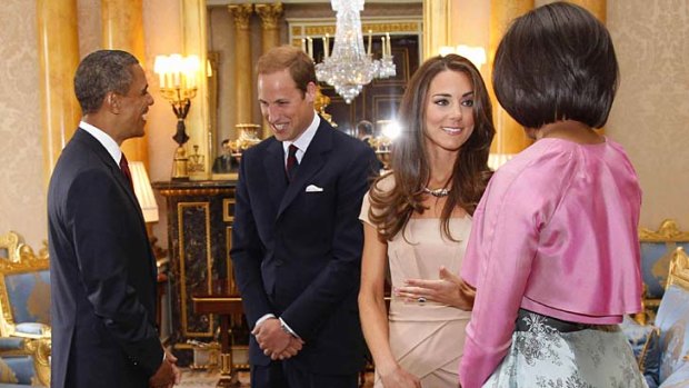 Setting off a fashion frenzy ... the Duchess of Cambridge chats to Michelle Obama, while  US President Barack Obama talks to Prince William.
