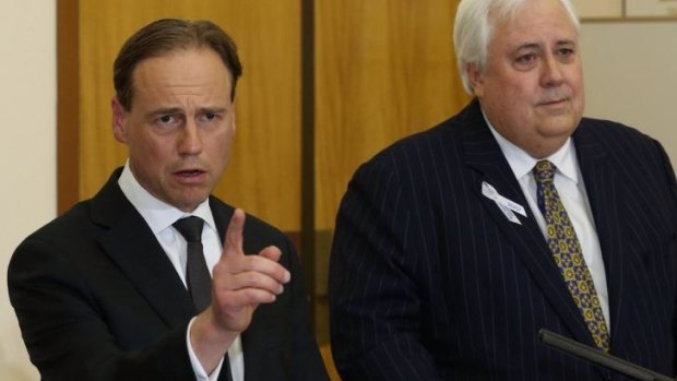 Greg Hunt and Clive Palmer address the media on Wednesday.