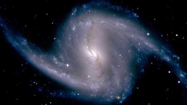 A zoomed-in image from the Dark Energy Camera of the barred spiral galaxy NGC 1365, in the Fornax cluster of galaxies, which lies about 60 million light years from Earth.