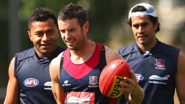 David Rodan, Shannon Byrnes and Aaron Davey at a Demons' training session at Gosch's Paddock in Friday.