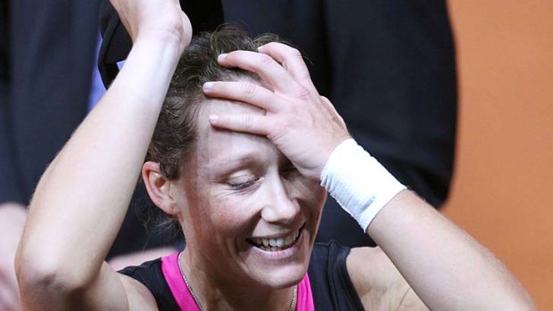 All smiles: Samantha Stosur reacts after beating German Andrea Petkovic 6-4, 6-1 on Sunday.