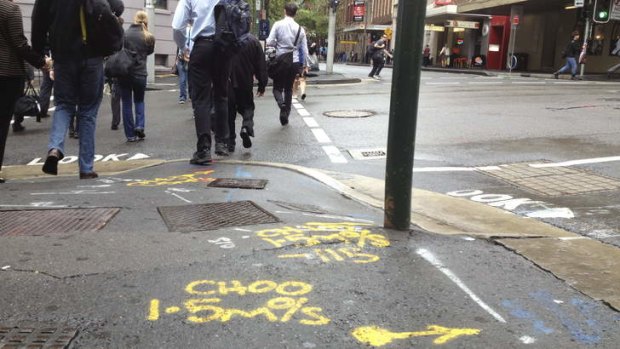 Rune the day: Street markings on the corner of Druitt and Kent streets in Sydney.