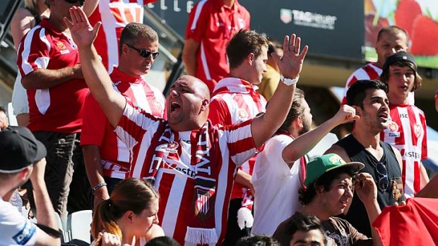 Melbourne Heart fans cheer their team during the round 16 match against Adelaide United.