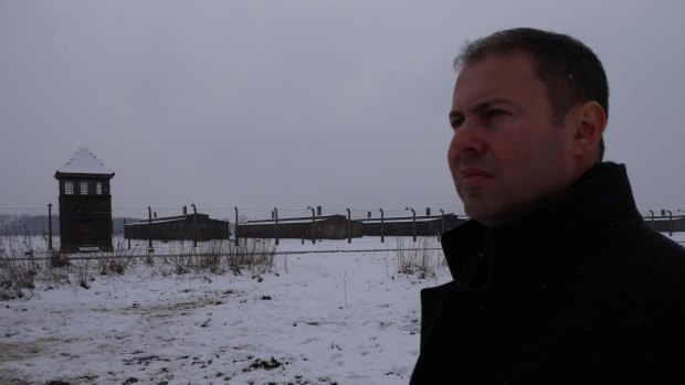 'It's chilling to think so many innocent people lost their lives here': Australia's Assistant Treasurer Josh Frydenberg looks out on the ruins of Auschwitz-Birkenau.