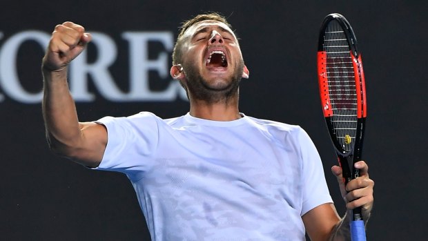 Britain's Daniel Evans celebrates after defeating Croatia's Marin Cilic in their second round match at the Australian Open tennis championships in Melbourne, Australia, Wednesday, Jan. 18, 2017. (AP Photo/Andy Brownbill)