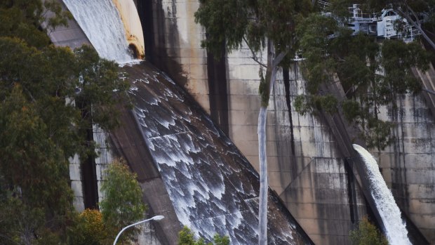 Water flows over the Warragamba Dam spillway on Thursday.