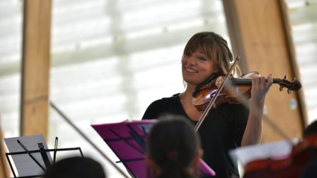 Sharing the joy: Nicola Benedetti leads a children's music workshop at Meadows Primary School,  Broadmeadows.