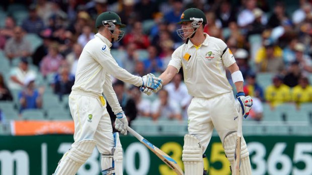 Sweet success: Michael Clarke and Brad Haddin congratulate each other after reaching a 100-run partnership at the Adelaide Oval on Friday.