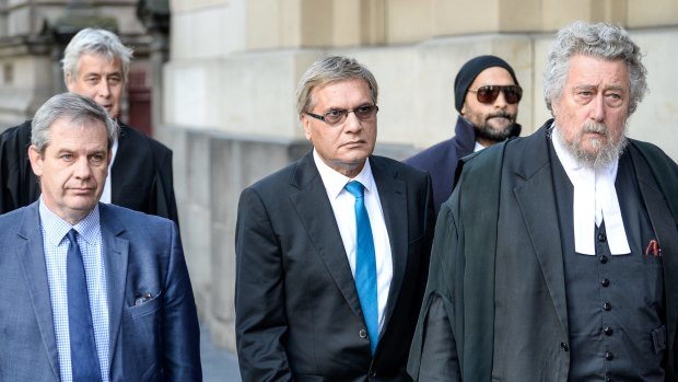 Art dealer Peter Gant and conservator Mohamed Aman Siddique leave the Court of Appeal after their sentences were quashed.