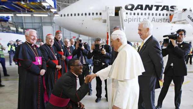 MonsignorJude Okolo farewells Pope Benedict at Sydney Airport.