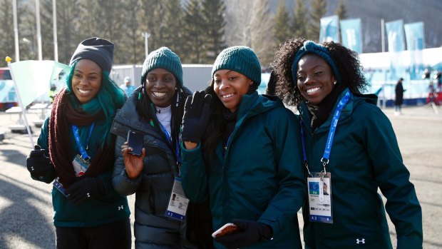 Faces of Nigeria: Akuoma Omeoga, Simidele Adeagbo, Ngozi Onwumere and Seun Adigun of the Nigerian Olympic team pose before a welcome ceremony inside the PyeongChang Olympic Village.