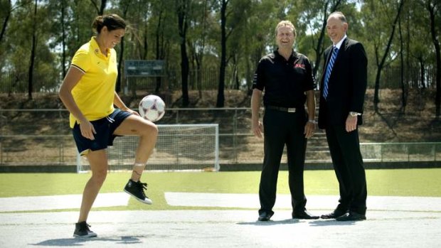 Matildas' Lydia Williams with Sports Technology International and Steve Jones ASC General manager of Corporate operations have signed a contract to develop a FIFA two star outdoor synthetic pitch at the Australian Institute of Sport which will assist the Matildas in the lead up to the 2015 World Cup in Canada.