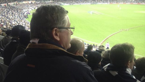 A man in the crowd: Victorian Premier Denis Napthine looks on during the Geelong-Fremantle thriller.