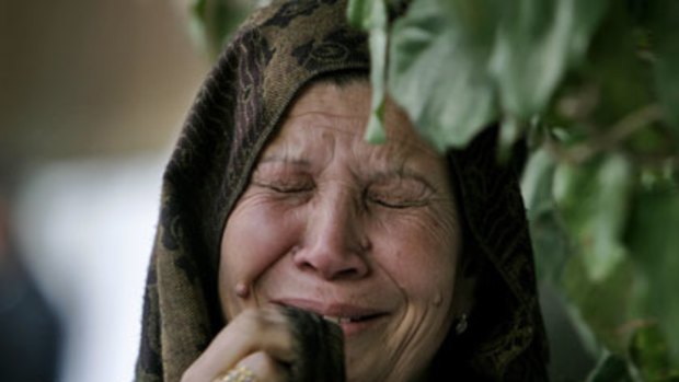 A Palestinian woman mourns the death of loved one following the attacks.