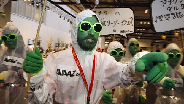 Activists from Avaaz.org dressed as aliens roam the halls of the Bella Center during the UN Climate Change Conference 2009.