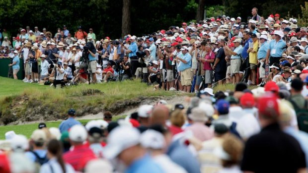 Fans gather to watch Tiger Woods in action.