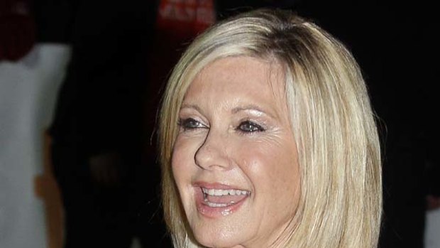 Olivia Newton-John arrives at the gala presentation for the film 'Score: A Hockey Musical ' during the 35th Toronto International Film Festival this week.