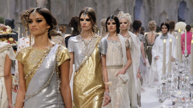 Models parade Karl Lagerfeld's new collection in Paris.
