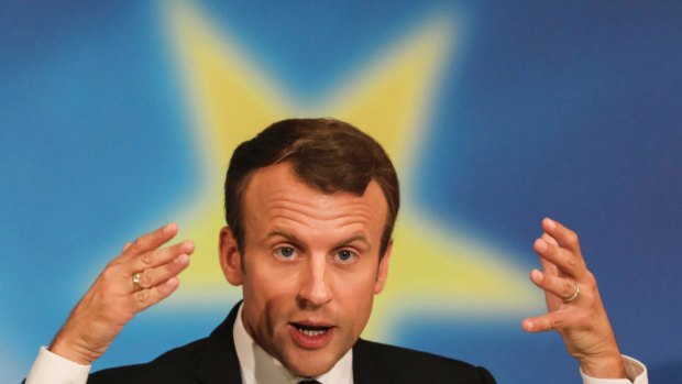 French President Emmanuel Macron gestures as he delivers a speech on the European Union at the amphitheater of the Sorbonne university in Paris.